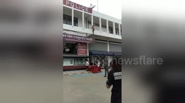 Police use sofa to catch woman falling from a ledge