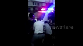 Villagers rescue police car stuck in mud