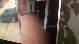 Moment woman backs straight into man guiding her into parking space
