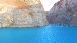 Flooded lime pond turns turquoise blue after continuous rain