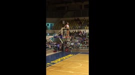 Players standing on hoops in amusing basketball game