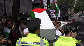 London demonstrators carry coffin emblazoned with Palestinian flag at Netanyahu protest