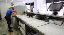 Fish shop worker sets new record to become world's fastest chip wrapper