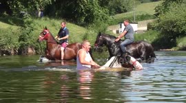 Horses get washed in the River Eden at the Appleby Fair