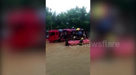 Get me to the exam on time! Fire engines transport students through China floods