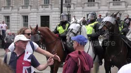 Tommy Robinson supporters goad police at London protest