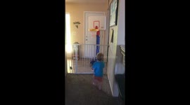 2 year old draining 3 pointer from over the baby gate