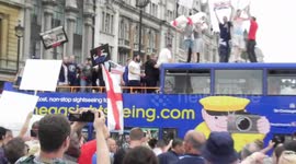 Far-right supporters of Tommy Robinson take over sightseeing bus