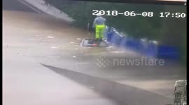 Cop breaks through sunroof to save driver trapped in flooded car