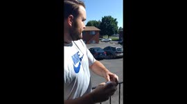 US dad successfully launches his kid's diaper across parking lot, straight into bin