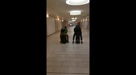 2 MEN RIDING THEIR LUGGAGES HOME