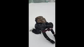 MAN SWIMMING THROUGH SNOW