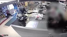 Terrifying footage captured armed robbers holding up post office and newsagent to steal just over £1,000