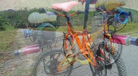 Father test rides his daughter's push bike after petrol engine modification
