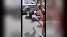 Newsflare Edit - PART 1 Police detain black male for wanting to walk into the police car - RounzTv