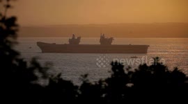 HMS Queen Elizabeth captured in front of beautiful Cornwall sunrise