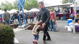Dad and Daughter Dance Together at Farmers' Market
