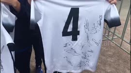 Kids with autographed shirts