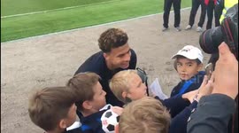 Dele Alli signs footballs and takes selfies with Russian kids