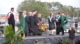 Graduate nonchalantly performs backflip after receiving diploma