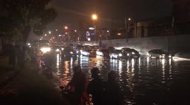 Cars stranded in flood water after tropical storm hits the Philippines
