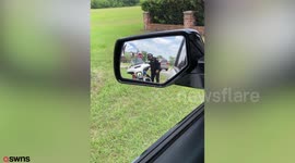 Hilarious footage shows a policeman being bribed with a doughnut