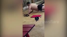 Man bounces belly on floor when does push-ups