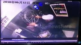 Elevator drags bicycle up after getting stuck in doors
