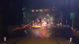 Passengers cling to bus through flooded roads in Philippines