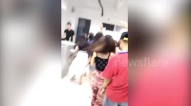 Chinese university students party in classroom to celebrate graduation