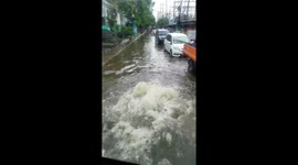 Bizarre sight of water bubbling up through ground on flooded street in Philippines