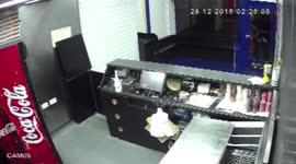 Pizza shop owner tackles arsonists trying to set his business alight