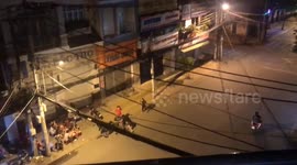 The drunken men fight on the street