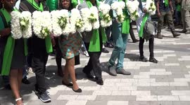 Humanity 4 Grenfell column in green is walking in silence towards Grenfell Tower