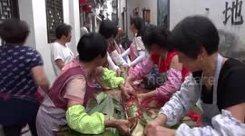 Villagers make 20-metre-long rice dumpling for Dragon Boat Festival