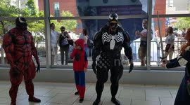 First day of Comic Con in Denver at the Colorado convention center.  A lot people in customs walking in and Venom posing