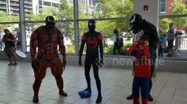 First day of Comic Con in Denver at the Colorado convention center.  A lot people in customs walking in and Venom posing