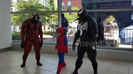 First day of Comic Con in Denver at the Colorado convention center.  A lot people in customs walking in and Venom posing