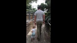 Cute moment of daddy and daughter walking together