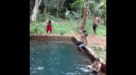 Funny Boys Play in Village Pond