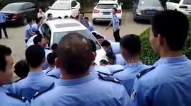 Students pick up car that was in the way of their graduation photo