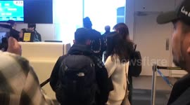 US police escort man off plane after he ran on without paying for baggage