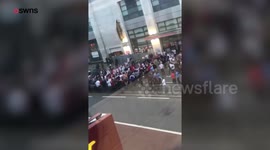 Football fan climbs on board MOVING car to celebrate England's world cup win