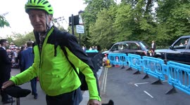 Newsreader Jon Snow arrives at celeb bash in London on a bike
