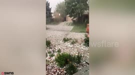 Hailstones the size of tennis balls damaging homes and cars