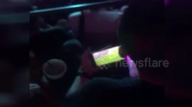 Man watches World Cup on phone while at Jay Chou concert