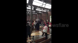 Fans throw benches as fight breaks out between Polish and Senegalese supporters