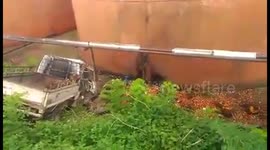 Truck slides off road in East Borneo