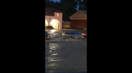 Rushing floodwaters wash car away in Pittsburgh parking lot