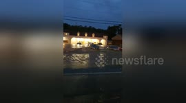 Rushing floodwaters wash car away in Pittsburgh parking lot
